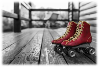 A pair of red leather roller skates with yellow trim and details in the foreground on the porch of a home the background is in black and white and grey tones 