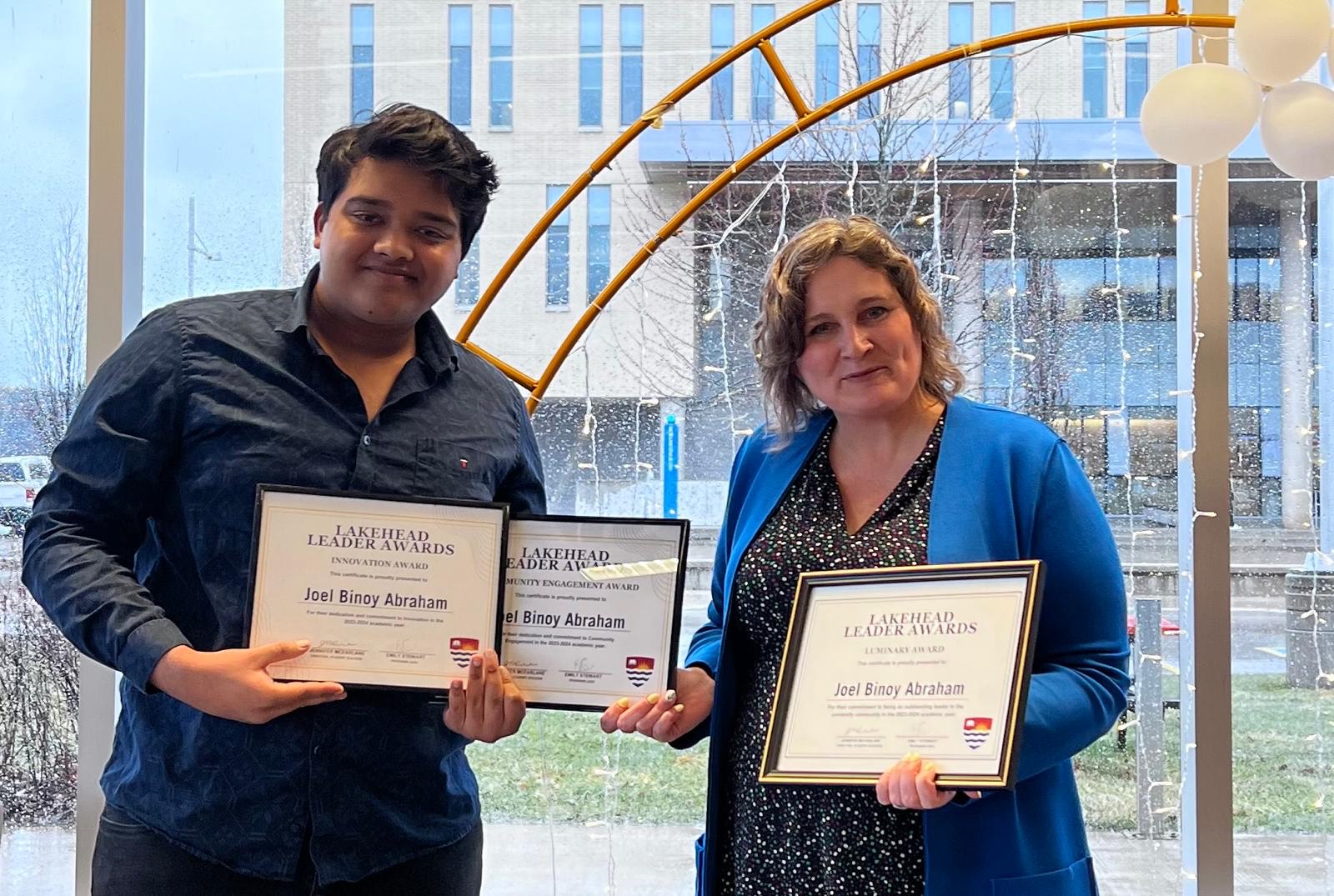 Student Joel Abraham and Dr. Linda Rodenburg at the 2025 Lakehead Leader Awards Ceremony Orillia student Joel Abraham accepts three Lakehead Leader Awards from Orillia Principal Dr. Linda Rodenburg