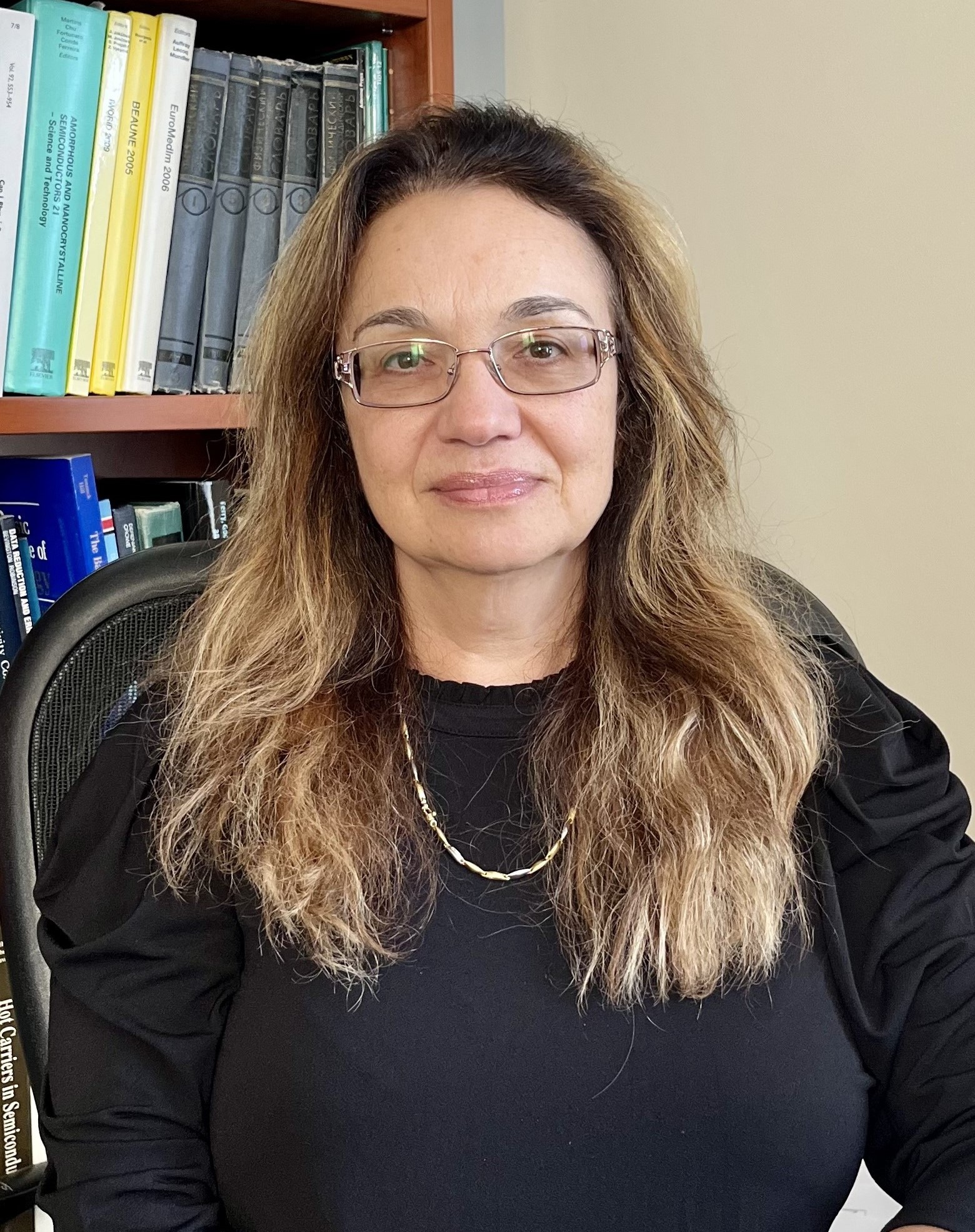 Dr. Alla Reznik Dr. Alla Reznik sits in a office with a bookcase in the background