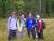 Four female students standing in tall grass