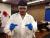 Aboriginal student shows off his two test tubes of agar with newly planted wild rice seeds.