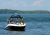 People on a boat in Lake Couchiching in the summer