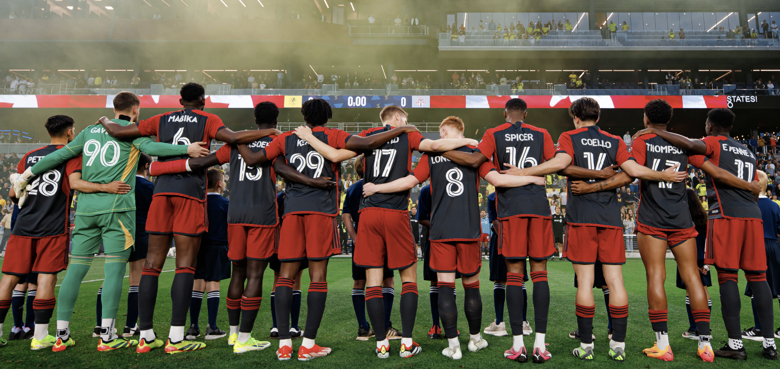 Toronto FC lined up in a row before the crowd