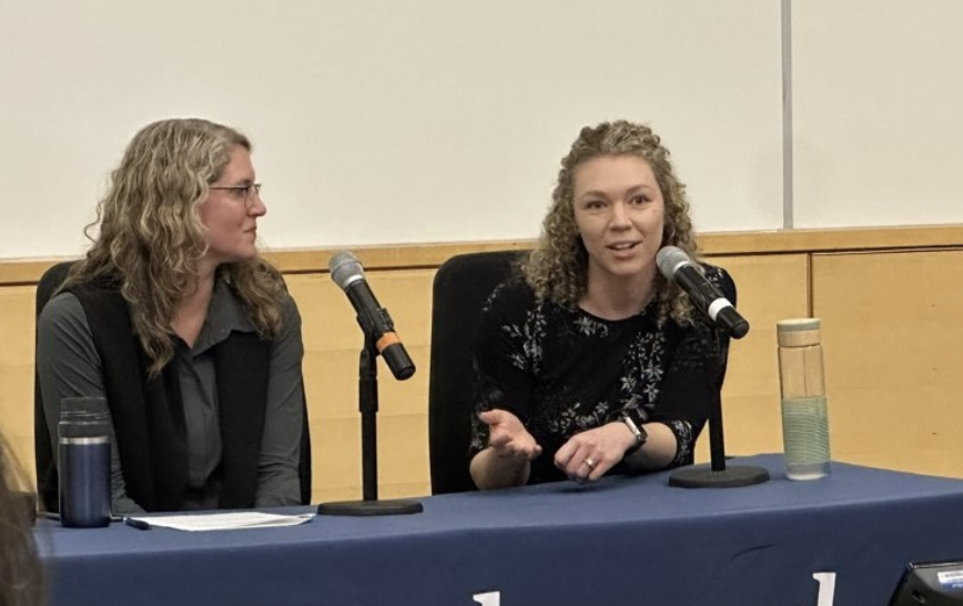 Sidney presenting at a conference Sidney presenting at a conference