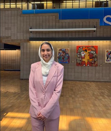 Simran Bedi Portrait Simran Bedi standing in the Agora, a Lakehead University Building