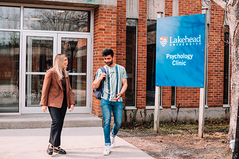 Two people exiting the psychology clinic